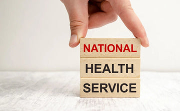 national health service (NHS) written on wooden blocks